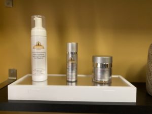 Display case including three facial rejuvenation products